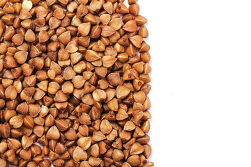 Close up of buckwheat grains isolated on white background