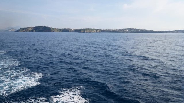 Campi Flegrei, Naples, Campania, Italy - December 5, 2019: boat leaving the island of Procida.