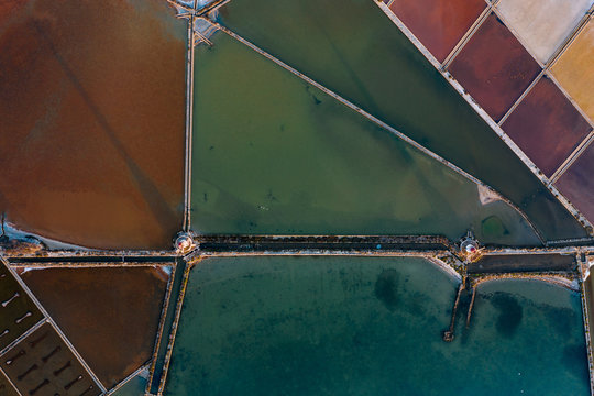 Aerial image of colorful salt mines in Sicily, Italy.