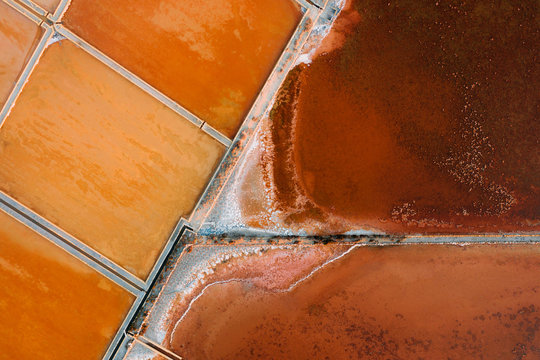 Aerial image of colorful salt mines in Sicily, Italy.