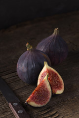 Fresh ripe figs. Breakfast with figs, cheese, honey and nuts. A few figs on an old wooden...