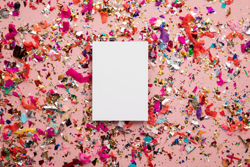 Blank card on colourful party sparkling party confetti