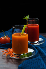 Homemade vegan green juice with vegetables, carrots, celery and tomatoes. Antioxidant drink