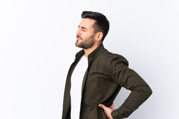 Young handsome man with beard over isolated white background suffering from backache for having made an effort