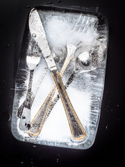 cutlery frozen on dark background