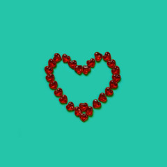 Red heart made of sweets.Valentine's day candy greeting card