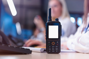 Security guard monitoring modern CCTV cameras in a surveillance room. Group of security guards...