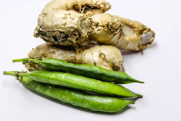 A picture of ginger with green peas