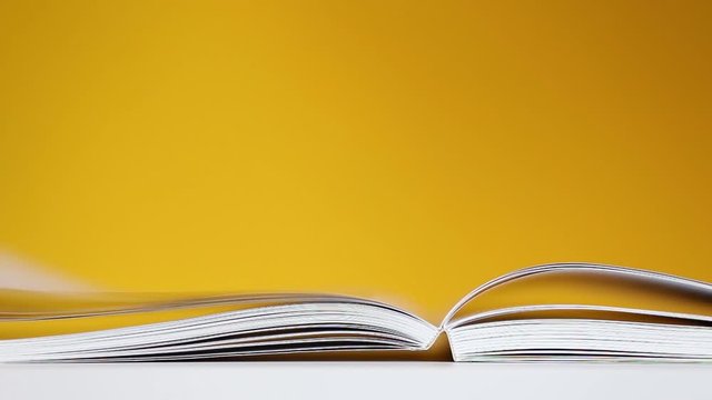 wind turns the pages of a book