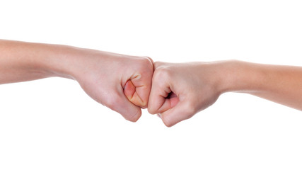 Hands giving a fist bump on white background