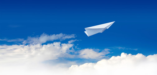 Fototapeta na wymiar Paper plane in the blue sky.