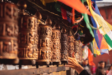 Fototapeta na wymiar Buddhist prayer wheel at Swayambunath stupa, monkey temple, Kathmandu, Nepal