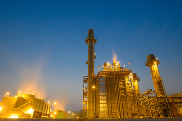 Fototapeta na wymiar Glow light of petrochemical industry on sunset and Twilight sky ,Power plant,Energy power station area