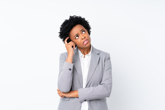 African american business woman over isolated white background having doubts and with confuse face expression
