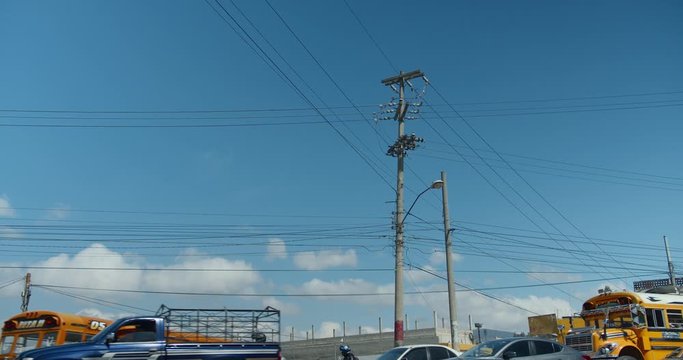 Electricity and telephone pole with time lapse traffic in Xela Quetzaltenango