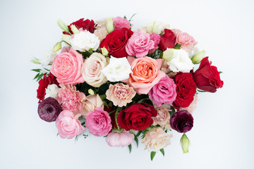 Wedding floral centerpiece with carnations roses and ranunculus