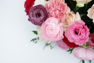 Wedding floral centerpiece with carnations roses and ranunculus