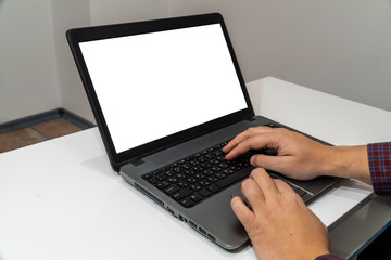 Above view of man typing on a laptop