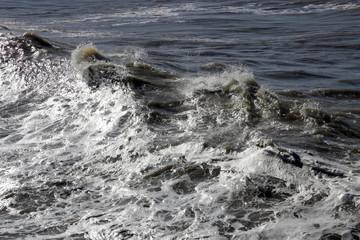 waves crashing on rocks
