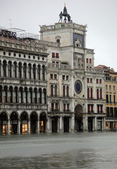 Fototapeta na wymiar ancient Clock in Venice with high tide