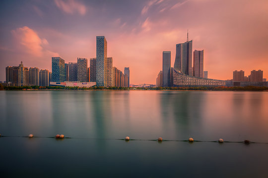 sunset over Swan Lake financial business district, Hefei city, China