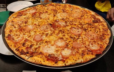 full size margarita pizza ready to eat