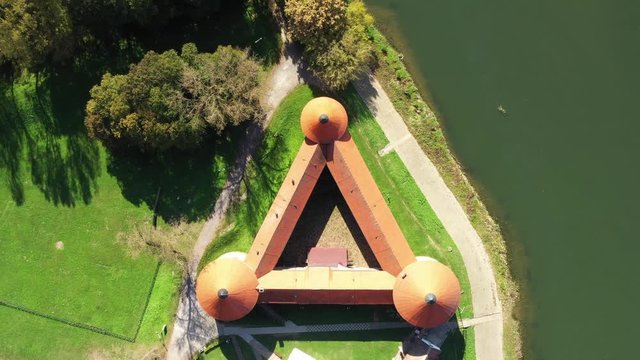Croatia, old fortress in the town of Sisak on the banks of Kupa River in autumn, drone aerial overhead footage, zoom in