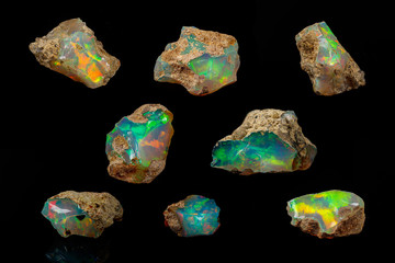 macro mineral stone rare and beautiful opals on a black background