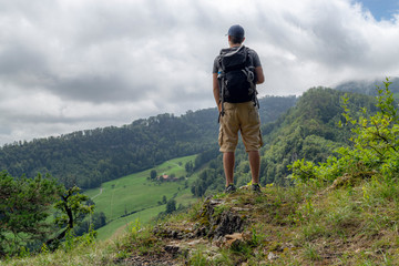 Fototapeta na wymiar Young man enjoying the view while hiking