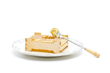 Honeycomb in a wooden frame on a plate 