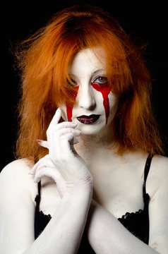 Beautiful Young woman as sexy vampire halloween portrait