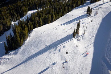 Aerial view winter recreation and sports in Copper Mountain in Colorado with snow fall