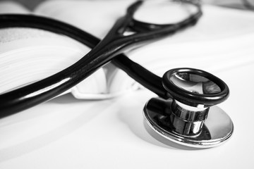 stethoscope on a white book