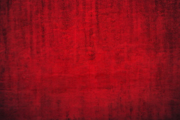 Texture of dark red festive background. Dark red background with dimming.