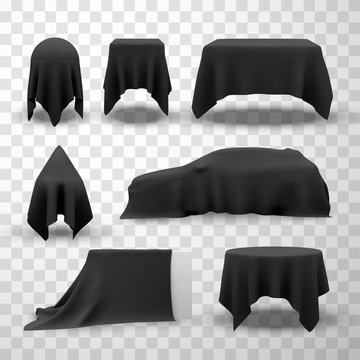 Collection of black satin clothes covering tables