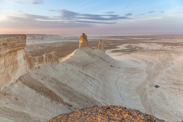 The Ustyurt Plateau. District of Boszhir. A group of tourists in cars stopped for the night. The bottom of a dry ocean Tethys. Rocky remnants. Kazakhstan. long shutter speed