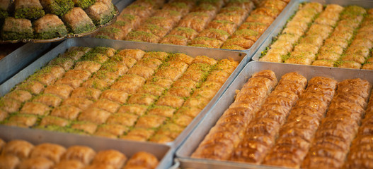 wallnut, pistachio turkish style antep baklava banner presentation. Traditional turkish delight dessert. Havuc dilimi.