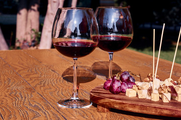 Glasses Of Fine Red Wine With Grape and Cheese
