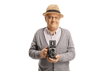 Elderly man holding an old-fashined vintage camera