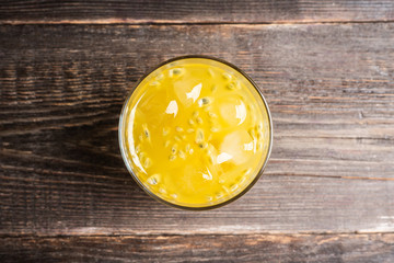 Old fahioned passion fruit cocktail on the rustic background. Selective focus. Shallow depth of field.