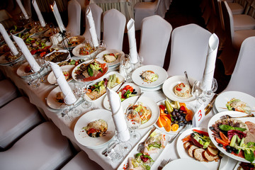 Table with food before the banquet. Ready for guests hall.