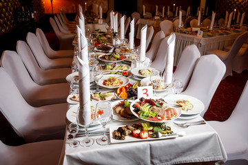 Table with food before the banquet. Ready for guests hall.