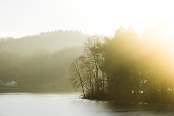 Obraz na płótnie Canvas glowing sunlight on frozen river