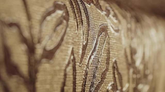 Rolls with wallpaper. Ornament close-up. Stand with wallpaper in the store