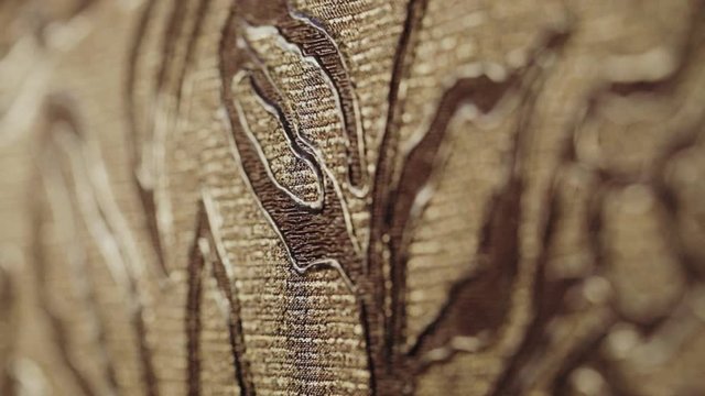 Rolls with wallpaper. Ornament close-up. Stand with wallpaper in the store