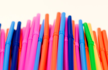 a group of colored plastic cocktail straws.