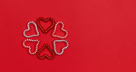 Happy Valentines day! Heart shape on red paper background. Flat lay