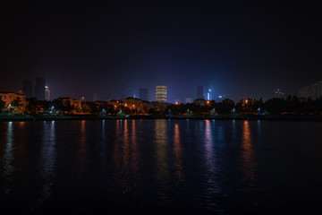 Fototapeta na wymiar Night embankment. City quay landscape in Weihai.