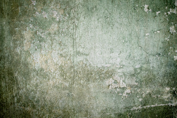 Old green wall with peeling paint
