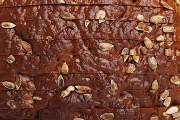 Background of Dark rye bread with sunflower seeds